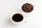 Coffee and coffee beans in white cups, white background