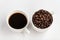 Coffee and coffee beans in white cups, white background