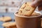 Coffee companionship Sweet cookies gracefully poured into a coffee mug