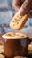 Coffee companionship Sweet cookies gracefully poured into a coffee mug