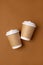 Coffee craft paper cups with place for logo on brown background, natural color, for menu and restaurants