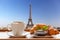 Coffee with croissants against Eiffel Tower in Paris, France