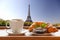 Coffee with croissants against Eiffel Tower in Paris, France