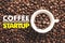 Coffee cup on background with message `COFFEE STARTUP`