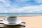 Coffee cup on the beach