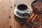 Coffee cup and beans on old woodden table