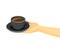 Coffee cup black on saucer on the plate in human hand