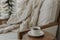 Coffee cup with blurred background of a cozy armchair covered with a blanket