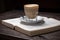 Coffee cup cappuccino hot latte or coffee with milk in a glass cup, open book