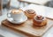 Coffee Cup and Cinnamon Roll on Wooden Tray