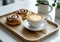 Coffee Cup and Cinnamon Roll on Wooden Tray