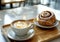 Coffee Cup and Cinnamon Roll on Wooden Tray