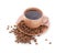 Coffee cup with coffee beans around crumbles, isolated