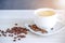 Coffee in cup and coffee beans, isolated spread on a white background