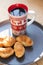 Coffee in a cup and croissants on a plate. Food and drinks. Plate on a wooden background