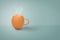 Coffee cup from egg shell with smoke on pastel blue background with copy space. Minimal style
