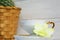 A coffee cup with espresso, orchid on the sauser and cactus in the basket on a wooden painted background