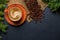 Coffee cup and fir tree branches in cozy setting