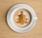 Coffee cup with foam and christmas tree shape
