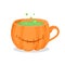 Coffee cup in form of pumpkin with green potion. Halloween