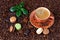 Coffee cup and French macaroons on dark background