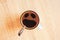 Coffee cup with funny scream in fear face, top view. Shocked, stressed, angry, scary and furious foam smile head