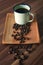 Coffee cup and Indonesia coffee beans on table