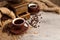 Coffee cup and old vintage coffee grinder over wooden background