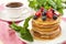 Coffee cup and pancakes with berries