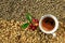 Coffee cup and red with green leaves coffee sherry and dried.coffee beans processed backgrounds