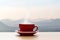Coffee cup red with morning sunshine mountain view