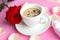 coffee cup and red rose, closeup. Valentine`s Day or Wedding greeting card.