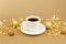 Coffee Cup with saucer, gold christmas balls and pieces of gold paper firecracker on golden background. Aroma and good morning new