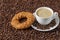 Coffee cup and simit sesame bagel from above.