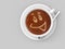 Coffee cup sitting on a saucer with a smiley face drawn in the foamy latte