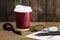 Coffee cup ,Smoke pipe ,glasses,pen and Paper on wood Table : Still Life