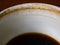 Coffee cup stained, americano coffee drink left over on wooden table background, Close up and macro shot, Selective focus