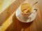 Coffee cup with stains left after drink during brake time on wooden table background and warm sunlight morning soft focus at