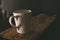 Coffee cup with steam set in low light background,Coffee in love concept.