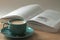 Coffee cup on the teble and book