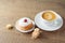 Coffee cup with traditional donuts sufganiyah for Jewish holiday Hanukkah on wooden table