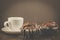 coffee cup and a two chocolate muffin/coffee cup and a two chocolate muffin on a dark background, selective focus