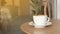 Coffee cup on wood table in cafe background, old wooden table. Simple workspace or morning coffee break