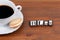 Coffee cup on a wooden table and text - Blog