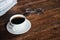 Coffee cups and books placed on old wooden tables