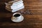 Coffee cups and books placed on old wooden tables