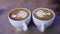 Coffee Cups With Latte Art On Table In Cafe Closeup