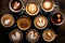 Coffee cups with latte art on wooden table, top view, Multiple cups of coffee with variety of coffee drinks overhead view, AI