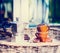 Coffee cups and pot full coffee beans on garden or terrace table over nature background