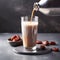 Coffee with date syrup and vegetable milk in glass beaker on dark marble background. Date syrup trendy. Spring or summer